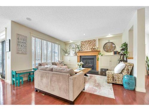 263 Discovery Ridge Boulevard Sw, Calgary, AB - Indoor Photo Showing Living Room With Fireplace