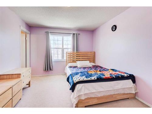 50 Prestwick Rise Se, Calgary, AB - Indoor Photo Showing Bedroom