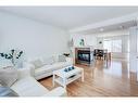 50 Prestwick Rise Se, Calgary, AB  - Indoor Photo Showing Living Room With Fireplace 