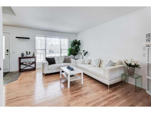 50 Prestwick Rise Se, Calgary, AB - Indoor Photo Showing Living Room