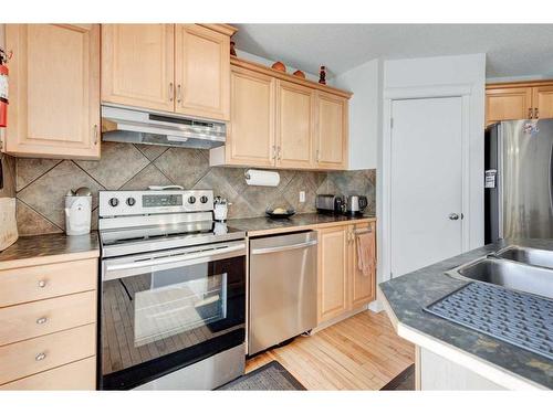 50 Prestwick Rise Se, Calgary, AB - Indoor Photo Showing Kitchen With Double Sink