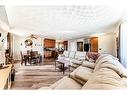 484 Queen Charlotte Road Se, Calgary, AB  - Indoor Photo Showing Living Room 