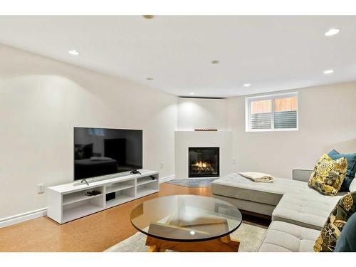 160 Sackville Drive Sw, Calgary, AB - Indoor Photo Showing Living Room With Fireplace