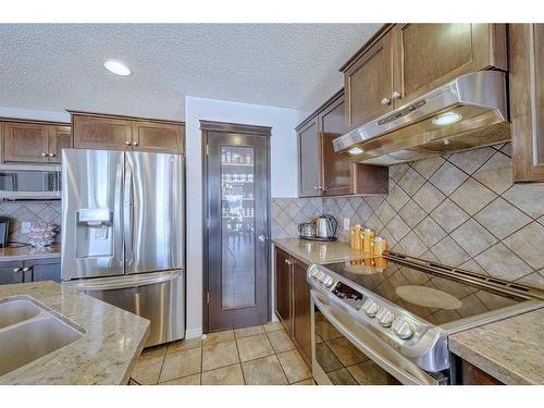 602 Kincora Bay Nw, Calgary, AB - Indoor Photo Showing Kitchen With Double Sink With Upgraded Kitchen