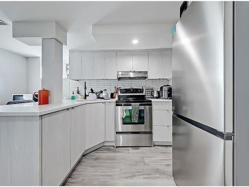 2119 22 Avenue Sw, Calgary, AB - Indoor Photo Showing Kitchen With Stainless Steel Kitchen