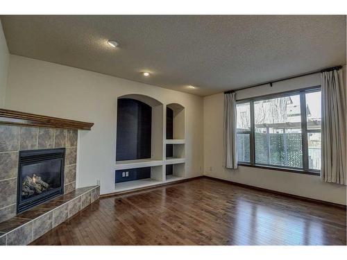 112 Brightonstone Bay Se, Calgary, AB - Indoor Photo Showing Living Room With Fireplace