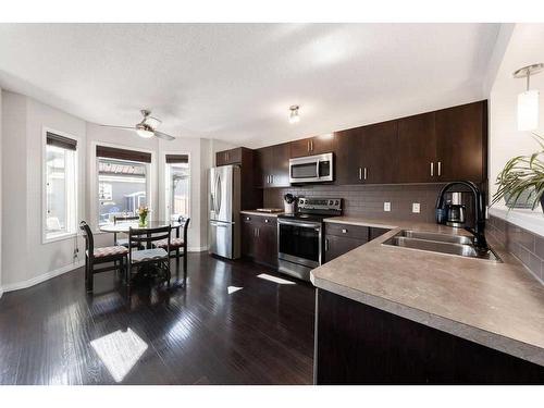 499 Auburn Bay Avenue Se, Calgary, AB - Indoor Photo Showing Kitchen With Stainless Steel Kitchen With Double Sink