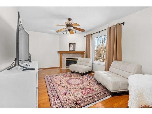 58 Hidden Valley Gate Nw, Calgary, AB - Indoor Photo Showing Living Room With Fireplace