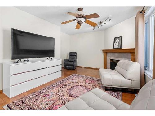 58 Hidden Valley Gate Nw, Calgary, AB - Indoor Photo Showing Living Room With Fireplace