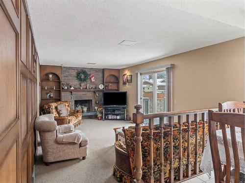 112 Parkside Place Se, Calgary, AB - Indoor With Fireplace