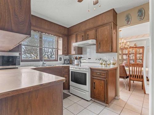 112 Parkside Place Se, Calgary, AB - Indoor Photo Showing Kitchen With Double Sink