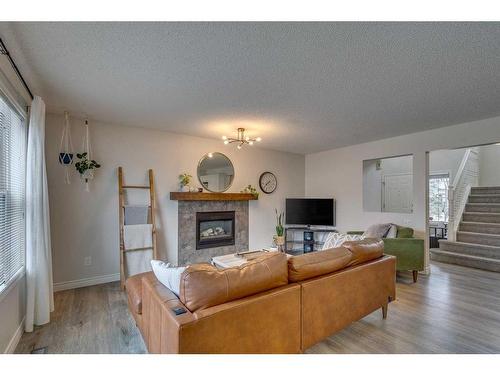 39 Chapalina Way Se, Calgary, AB - Indoor Photo Showing Living Room With Fireplace