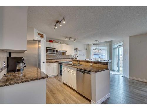 39 Chapalina Way Se, Calgary, AB - Indoor Photo Showing Kitchen With Stainless Steel Kitchen With Double Sink