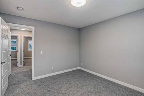 23 Agate Road, Cochrane, AB - Indoor Photo Showing Other Room