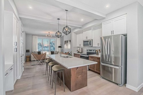 23 Agate Road, Cochrane, AB - Indoor Photo Showing Kitchen With Upgraded Kitchen