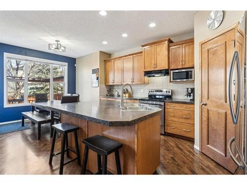 266 Cranwell Bay Se, Calgary, AB - Indoor Photo Showing Kitchen With Stainless Steel Kitchen With Double Sink