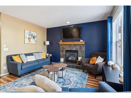 266 Cranwell Bay Se, Calgary, AB - Indoor Photo Showing Living Room With Fireplace