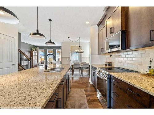 98 Marquis Common Se, Calgary, AB - Indoor Photo Showing Kitchen With Double Sink With Upgraded Kitchen