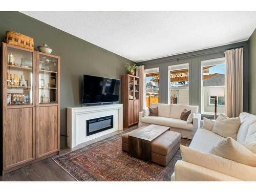 98 Marquis Common Se, Calgary, AB - Indoor Photo Showing Living Room With Fireplace