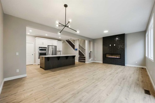 173 Edith Place Nw, Calgary, AB - Indoor With Fireplace