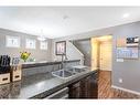 14 Copperpond Place Se, Calgary, AB  - Indoor Photo Showing Kitchen With Double Sink 