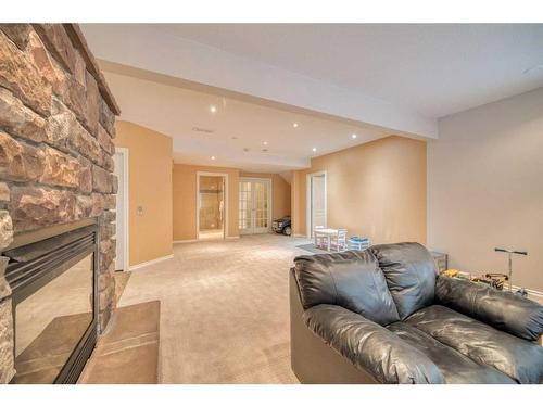 222 Discovery Place Sw, Calgary, AB - Indoor Photo Showing Other Room With Fireplace