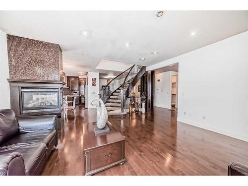 16 Rockcliff Point Nw, Calgary, AB - Indoor With Fireplace