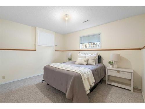 81 Shawinigan Road Sw, Calgary, AB - Indoor Photo Showing Bedroom