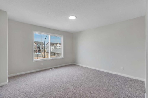 225 Heirloom Way Se, Calgary, AB - Indoor Photo Showing Other Room