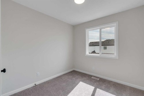 225 Heirloom Way Se, Calgary, AB - Indoor Photo Showing Other Room