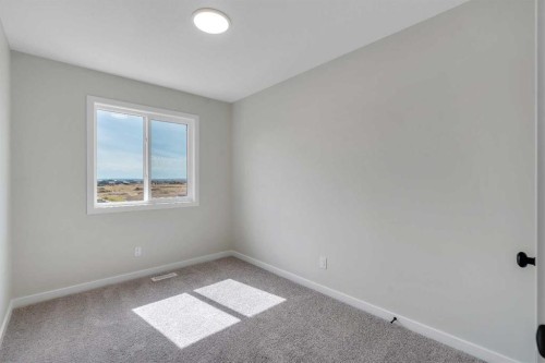 225 Heirloom Way Se, Calgary, AB - Indoor Photo Showing Other Room