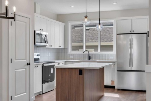 225 Heirloom Way Se, Calgary, AB - Indoor Photo Showing Kitchen With Stainless Steel Kitchen With Upgraded Kitchen