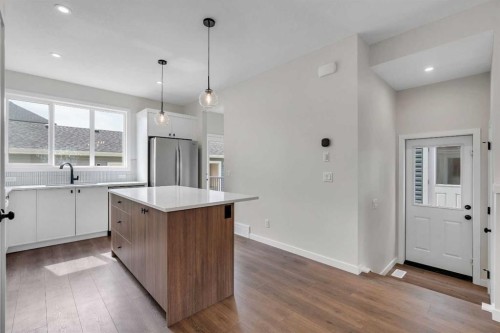 225 Heirloom Way Se, Calgary, AB - Indoor Photo Showing Kitchen With Stainless Steel Kitchen With Upgraded Kitchen
