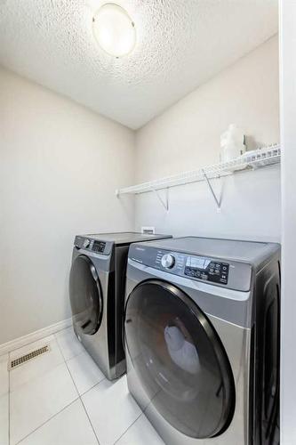 222 Cranston Gate Se, Calgary, AB - Indoor Photo Showing Laundry Room