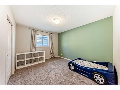 222 Cranston Gate Se, Calgary, AB - Indoor Photo Showing Bedroom