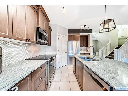 222 Cranston Gate Se, Calgary, AB - Indoor Photo Showing Kitchen With Double Sink With Upgraded Kitchen