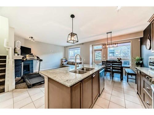 222 Cranston Gate Se, Calgary, AB - Indoor Photo Showing Kitchen With Double Sink