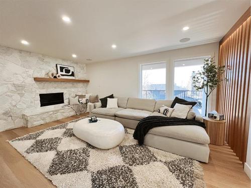 52 Patterson Crescent Sw, Calgary, AB - Indoor Photo Showing Living Room With Fireplace