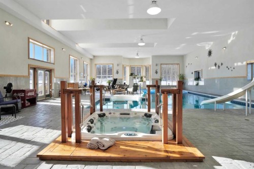 31027 Range Road 50, Rural Mountain View County, AB - Indoor Photo Showing Other Room With In Ground Pool