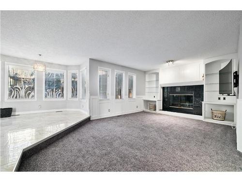 207 Hawkview Manor Circle Nw, Calgary, AB - Indoor Photo Showing Living Room With Fireplace