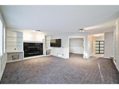 207 Hawkview Manor Circle Nw, Calgary, AB - Indoor Photo Showing Living Room With Fireplace