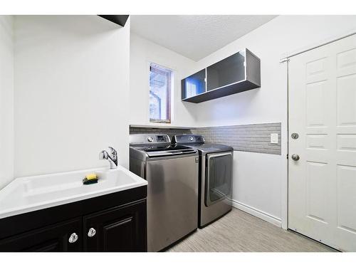 207 Hawkview Manor Circle Nw, Calgary, AB - Indoor Photo Showing Laundry Room