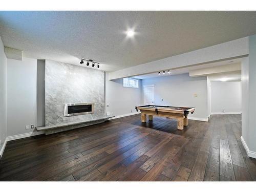 207 Hawkview Manor Circle Nw, Calgary, AB - Indoor With Fireplace