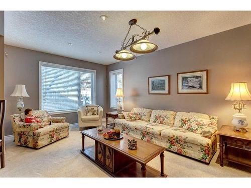 4 Evergreen Way Sw, Calgary, AB - Indoor Photo Showing Living Room