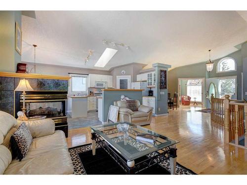 4 Evergreen Way Sw, Calgary, AB - Indoor Photo Showing Living Room With Fireplace