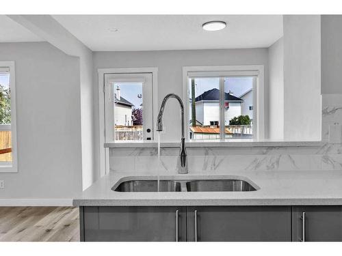 215 Coral Springs Circle Ne, Calgary, AB - Indoor Photo Showing Kitchen With Double Sink