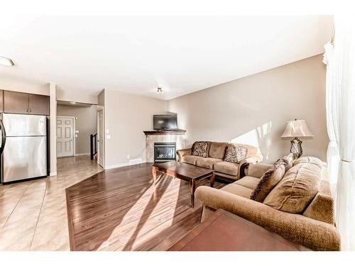 50 Everwoods Link Sw, Calgary, AB - Indoor Photo Showing Living Room With Fireplace