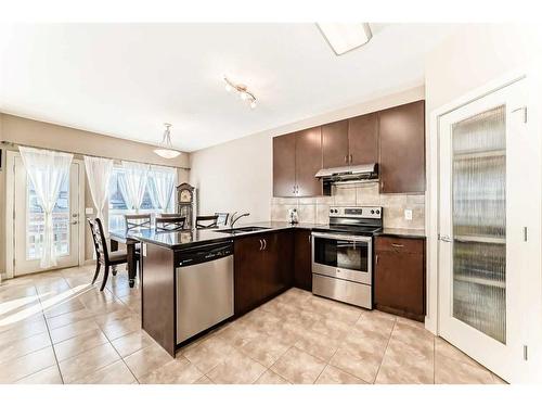 50 Everwoods Link Sw, Calgary, AB - Indoor Photo Showing Kitchen With Double Sink