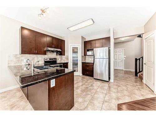 50 Everwoods Link Sw, Calgary, AB - Indoor Photo Showing Kitchen With Double Sink