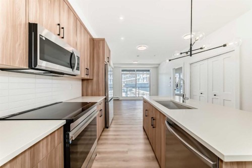 8202-1802 Mahogany Boulevard Se, Calgary, AB - Indoor Photo Showing Kitchen With Upgraded Kitchen